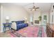 Cozy living room with vaulted ceilings, a fireplace, hardwood floors, and abundant natural light at 110 Oak Park Dr, Benson, NC 27504