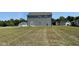Two story home with gray siding and a grassy lot at 111 Bonsai Way, Four Oaks, NC 27524