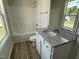 Bathroom featuring a tub/shower, vanity, and window at 111 Bonsai Way, Four Oaks, NC 27524