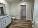The bathroom is equipped with double sinks, a shower, and a view into the closet at 111 Bonsai Way, Four Oaks, NC 27524