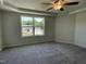 Bedroom featuring a ceiling fan and a window with a view of the property at 111 Bonsai Way, Four Oaks, NC 27524