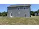 Two story home with gray siding and a grassy lot at 111 Bonsai Way, Four Oaks, NC 27524