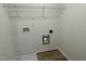 The laundry room provides hook-ups, storage, and is conveniently located near the bedrooms at 111 Bonsai Way, Four Oaks, NC 27524
