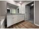 Main bathroom featuring dual sinks, a soaking tub, and modern fixtures at 111 Coharie Dr, Lillington, NC 27546