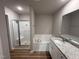 Bathroom featuring a shower and tub combination, modern fixtures, and stylish granite countertops at 111 Coharie Dr, Lillington, NC 27546