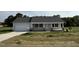 Charming single-story home featuring a welcoming front porch and attached garage at 111 Coharie Dr, Lillington, NC 27546