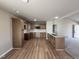 Well-equipped kitchen with wooden cabinets, modern appliances, and ample counter space at 111 Coharie Dr, Lillington, NC 27546