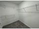 Walk-in closet with multiple shelves for organized storage of clothing and accessories at 111 Mahogany Way, Four Oaks, NC 27524