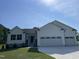 Charming single-Gathering home boasts a manicured lawn and an attached two-car garage at 111 Mahogany Way, Four Oaks, NC 27524