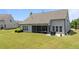 Aerial view showcasing backyard, screened porch, patio, and lush lawn at 1112 Monterey Bay Dr, Wake Forest, NC 27587