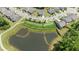 Scenic aerial view overlooking a serene pond and picturesque neighborhood at 1112 Monterey Bay Dr, Wake Forest, NC 27587