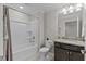 Bathroom features a shower-tub combo, granite vanity, and tile flooring at 1112 Monterey Bay Dr, Wake Forest, NC 27587