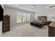 A spacious bedroom featuring carpet, and a large window at 1112 Monterey Bay Dr, Wake Forest, NC 27587