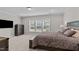 Comfortable bedroom featuring a queen size bed, dresser, and ample natural light at 1112 Monterey Bay Dr, Wake Forest, NC 27587