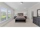 Light filled main bedroom with neutral walls, and soft carpet at 1112 Monterey Bay Dr, Wake Forest, NC 27587