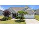 Charming single Gathering home showcasing manicured lawn and a two-car garage at 1112 Monterey Bay Dr, Wake Forest, NC 27587