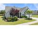Charming home with well-manicured landscaping, complemented by a covered entrance and inviting curb appeal at 1112 Monterey Bay Dr, Wake Forest, NC 27587