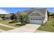 Charming home with well-manicured landscaping, complemented by a two-car garage and inviting curb appeal at 1112 Monterey Bay Dr, Wake Forest, NC 27587