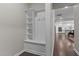 Hallway entrance with built-in bench and view of the kitchen at 1112 Monterey Bay Dr, Wake Forest, NC 27587