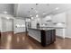 Spacious kitchen with large island, granite countertops, stainless steel appliances, and white cabinets at 1112 Monterey Bay Dr, Wake Forest, NC 27587