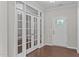 Office or den showcases beautiful french doors and hardwood flooring at 1112 Monterey Bay Dr, Wake Forest, NC 27587
