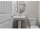 Charming powder room with pedestal sink and toilet at 1112 Monterey Bay Dr, Wake Forest, NC 27587