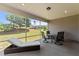 Relaxing screened porch with outdoor furniture and scenic backyard views at 1112 Monterey Bay Dr, Wake Forest, NC 27587