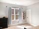 Bright bedroom with neutral walls, dresser, and a window with natural light and view of the trees at 1218 Rogers Farm Rd, Wake Forest, NC 27587