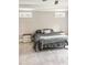 Neutral bedroom featuring a bed with gray bedding and side tables with a white drawer set at 1218 Rogers Farm Rd, Wake Forest, NC 27587