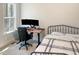 Cozy bedroom featuring a modern desk setup with dual monitors and a comfortable wrought iron bed at 1218 Rogers Farm Rd, Wake Forest, NC 27587