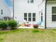 Lawn and patio of a well kept backyard with relaxing furniture at 1240 Gemfor St, Durham, NC 27703