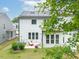 Home exterior showcasing a patio seating area and a well-manicured lawn in the backyard at 1240 Gemfor St, Durham, NC 27703