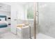Luxurious bathroom with a glass-enclosed shower, soaking tub, and access to the stylish primary bedroom at 1240 Gemfor St, Durham, NC 27703