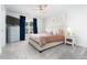 Cozy bedroom featuring plush carpet, ceiling fan, and ample natural light from the window at 1240 Gemfor St, Durham, NC 27703