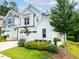 Beautiful home with white and blue exterior, well-maintained landscaping and a spacious two-car garage at 1240 Gemfor St, Durham, NC 27703
