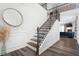 Elegant foyer featuring decorative trim, hardwood floors, and open staircase at 1240 Gemfor St, Durham, NC 27703