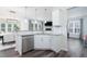 Bright kitchen with stainless steel appliances, granite countertops, and hardwood floors at 1240 Gemfor St, Durham, NC 27703