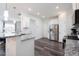 Open kitchen with stainless steel appliances, granite countertops, and a breakfast bar at 1240 Gemfor St, Durham, NC 27703