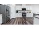 Modern kitchen featuring stainless steel appliances, ample counter space, and sleek cabinetry at 1240 Gemfor St, Durham, NC 27703