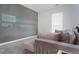 Relaxing Gathering room featuring comfortable sectional and a large media wall for entertainment at 1240 Gemfor St, Durham, NC 27703