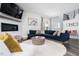 Spacious living room with hardwood floors, recessed lighting, and a cozy fireplace at 1240 Gemfor St, Durham, NC 27703