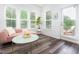 Inviting sunroom with ample natural light and a cozy seating area, creating a relaxing atmosphere at 1240 Gemfor St, Durham, NC 27703