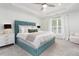 Serene main bedroom with a tray ceiling, plush carpeting, and a stylish upholstered headboard at 1240 Gemfor St, Durham, NC 27703