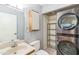 Cozy bathroom features a classic design with a mounted washer and dryer unit and tiled floors at 127 Finley Forest Dr, Chapel Hill, NC 27517