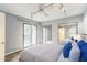 Bright bedroom with sliding glass doors to a balcony, mirrored closet, and overhead lighting at 127 Finley Forest Dr, Chapel Hill, NC 27517