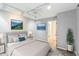 Bedroom featuring track lighting, soft grey walls, neutral carpet, and two landscape paintings at 127 Finley Forest Dr, Chapel Hill, NC 27517