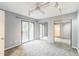 Bedroom with overhead lighting, access to a balcony, and mirrored closet doors at 127 Finley Forest Dr, Chapel Hill, NC 27517