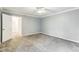 Spacious bedroom featuring plush carpeting, neutral walls, and a ceiling fan for added comfort at 127 Finley Forest Dr, Chapel Hill, NC 27517