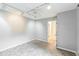 Bedroom features track lighting, soft grey walls, neutral carpet, and an ensuite bathroom at 127 Finley Forest Dr, Chapel Hill, NC 27517