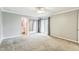 Bedroom with balcony access, ensuite bathroom, and mirrored closet at 127 Finley Forest Dr, Chapel Hill, NC 27517